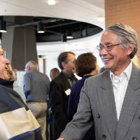 Lynn Blue greeting a guest at the Lynn M. Blue Connection Naming Ceremony